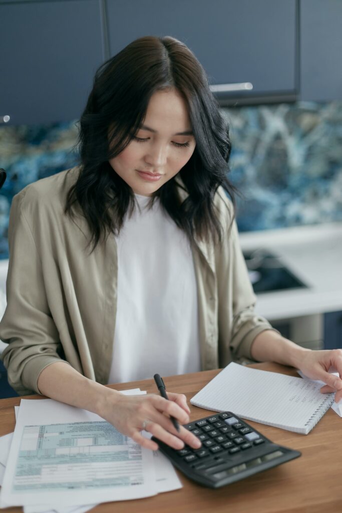 Woman calculating the cost of building a new home in australia